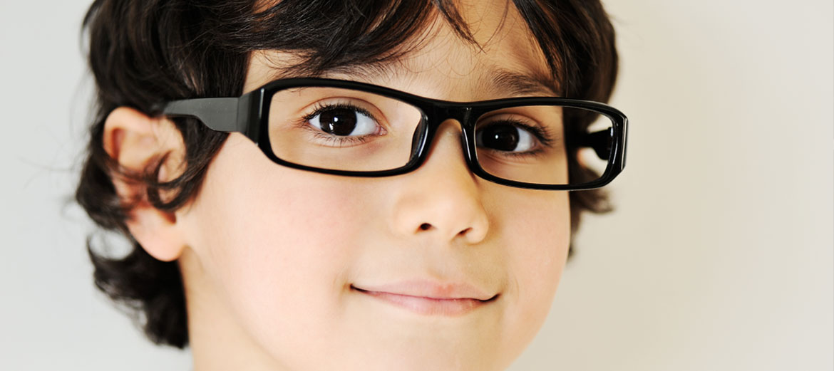 boy smiling wearing nice glasses frames