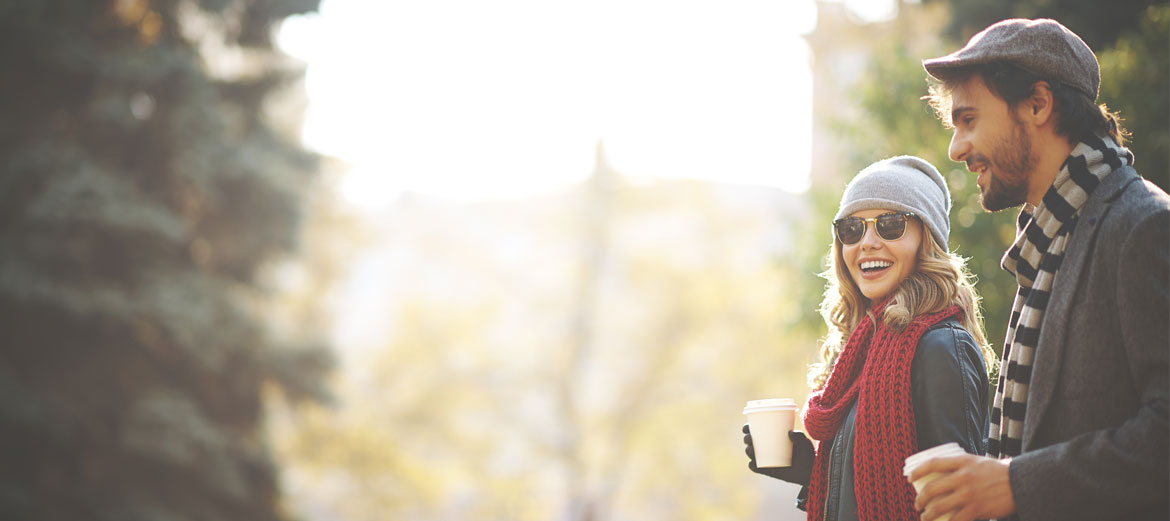 woman outside with coffee on a cool day